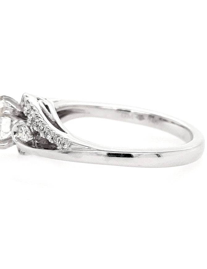 Diamond (0.60 ct center F-G/SI1, 0.76 ctw) swirl engagement ring, 14k white gold