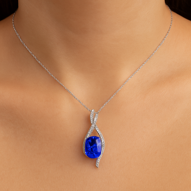 TQ tanzanite (11.47 ct) & diamond (0.50 ctw) pendant 14k white gold 6.5 gr