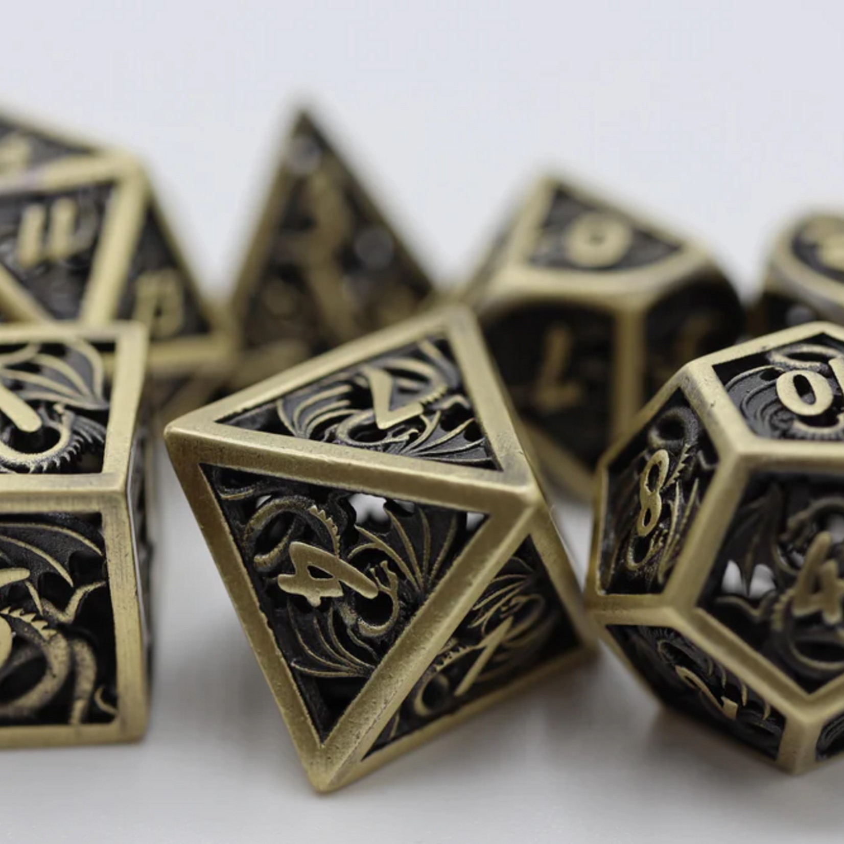 Foam Brain Games Dragon Essence Bronze Hollow Metal Polyhedral 7 die set