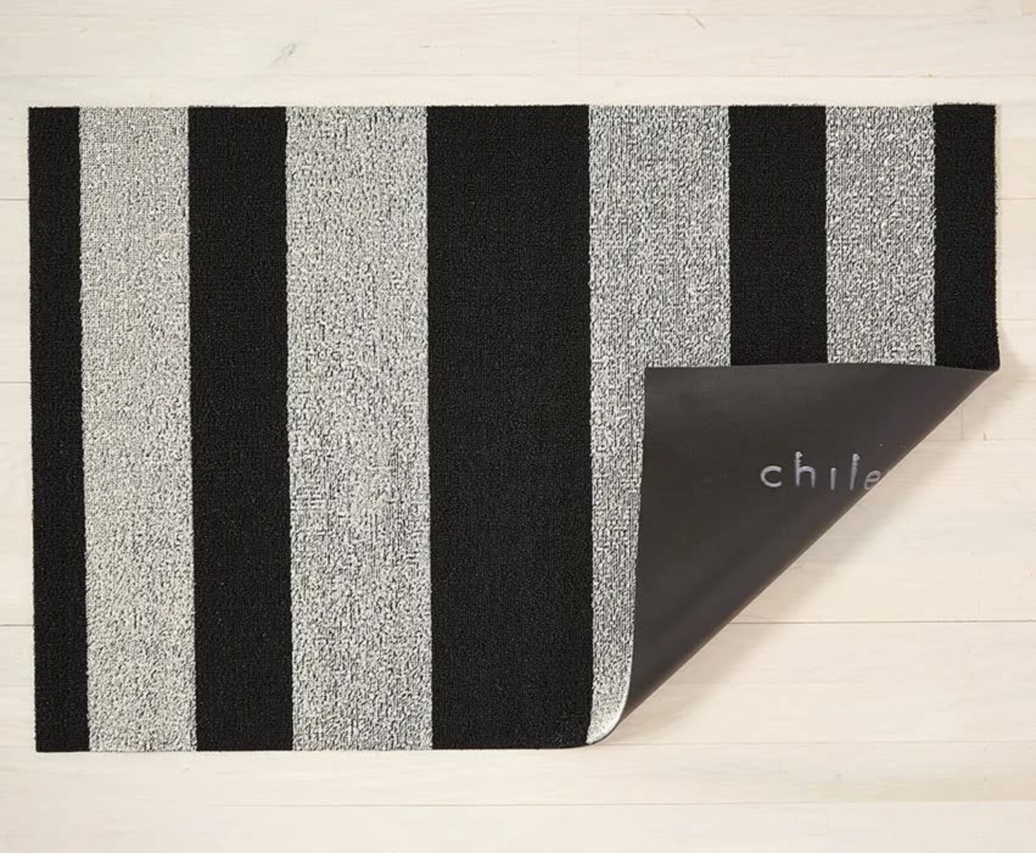 https://cdn.shoplightspeed.com/shops/641068/files/57169535/1500x4000x3/chilewich-bold-stripe-shag-utility-mat-assorted-co.jpg