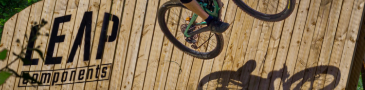 Leap Components banner with logo and carbon-filled nylon parts