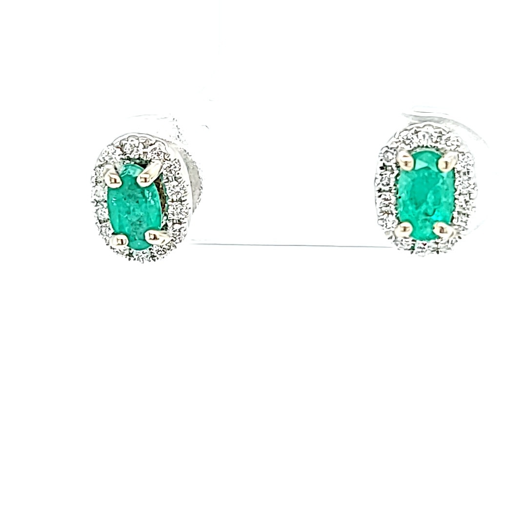14KW Oval Emerald Stud Earrings With a Diamond Halo .15cttw 14KW Oval Emerald Stud Earrings With a Diamond Halo .15cttw