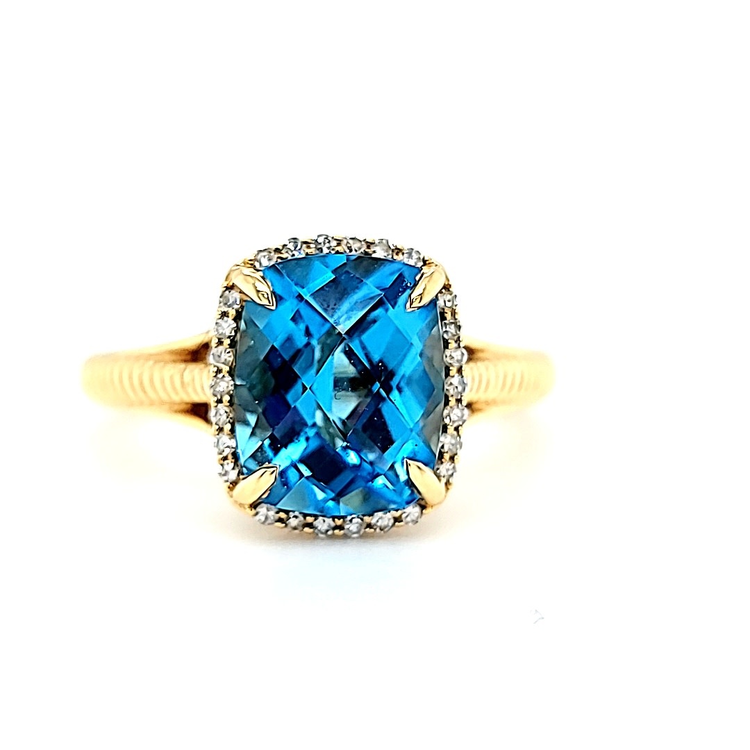 14KY Blue Topaz Ring With a Diamond Halo 14KY Blue Topaz Ring With a Diamond Halo
