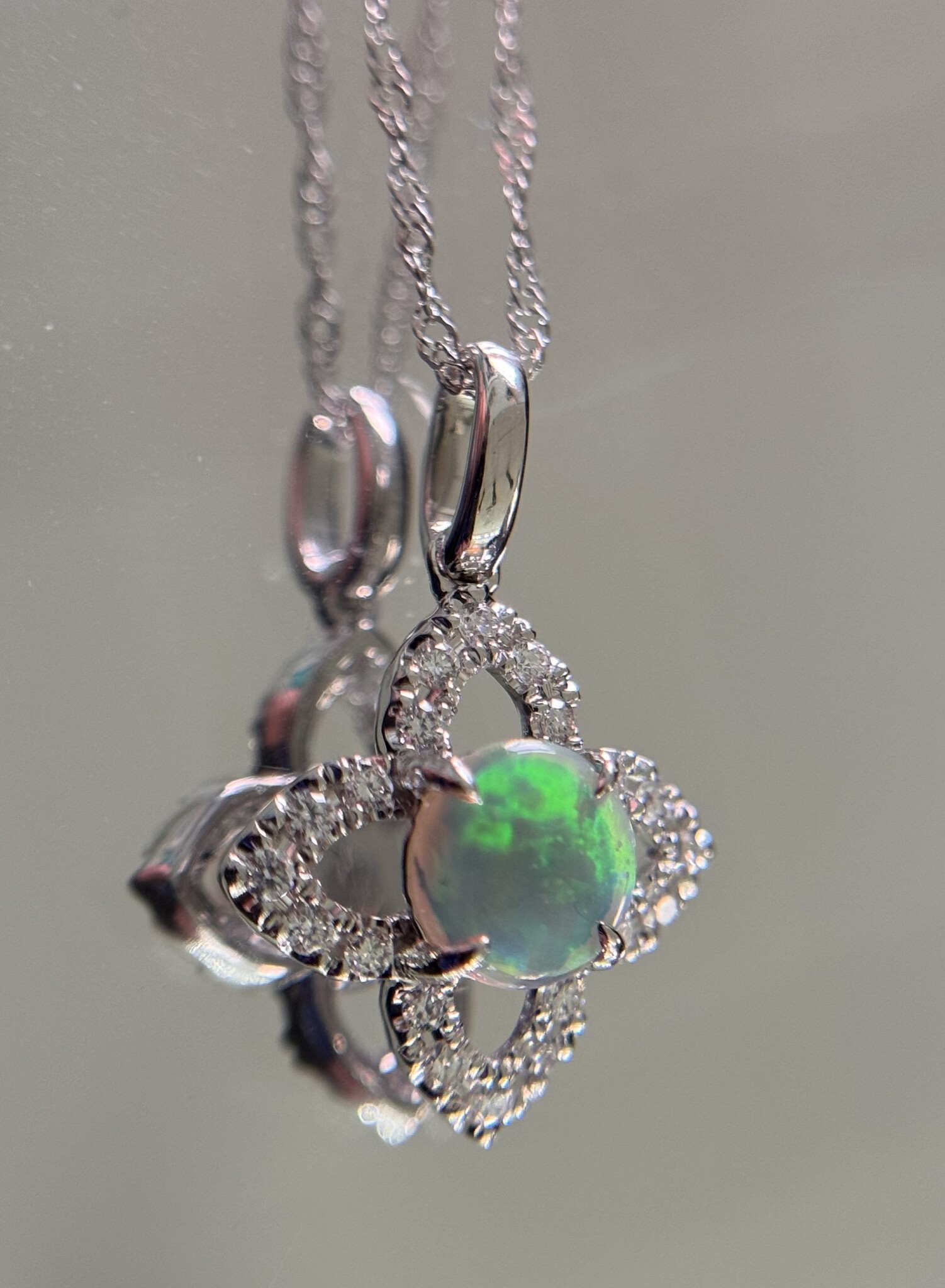 14KW Opal Pendant with a Diamond Halo