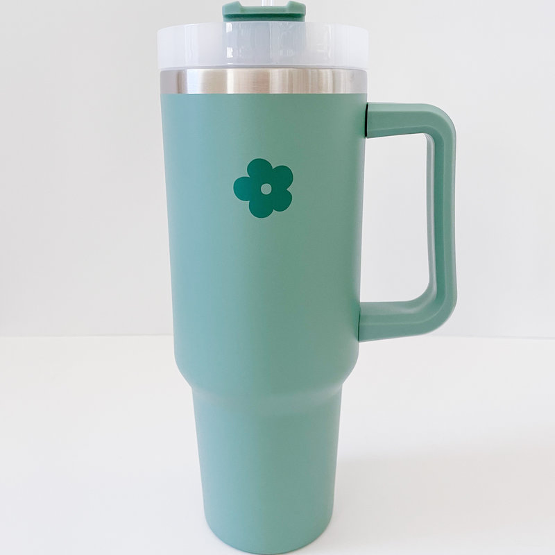 https://cdn.shoplightspeed.com/shops/641203/files/52675745/800x800x1/retro-flower-40-oz-handle-tumbler.jpg