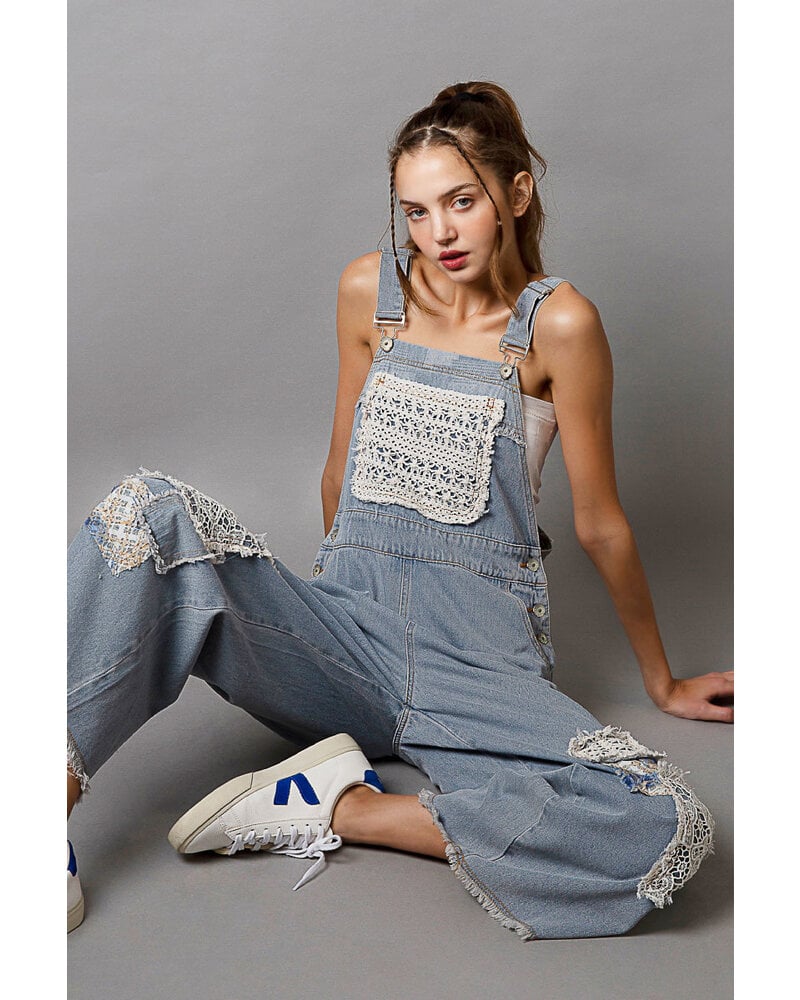 relaxed fit overalls with patch detail.