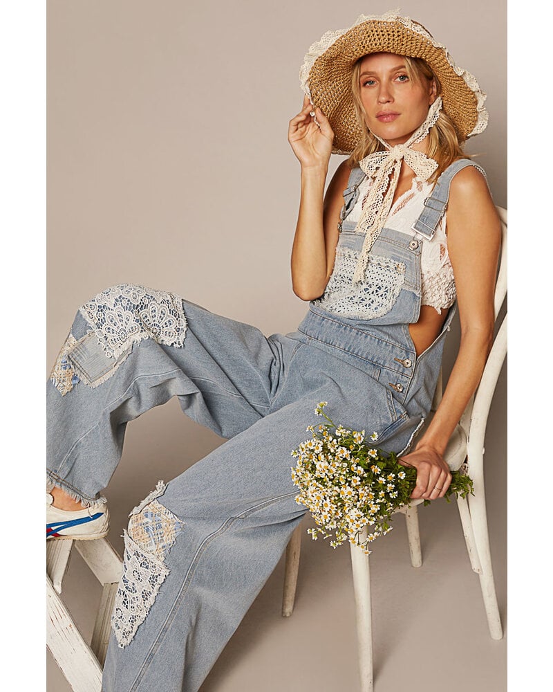 relaxed fit overalls with patch detail.