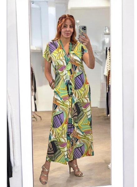Tropical Breeze Maxi Dress  Short Description: Flowy, lightweight maxi dress with vibrant tropical prints and side slits. Perfect for sunny days with a touch of elegance and comfort.