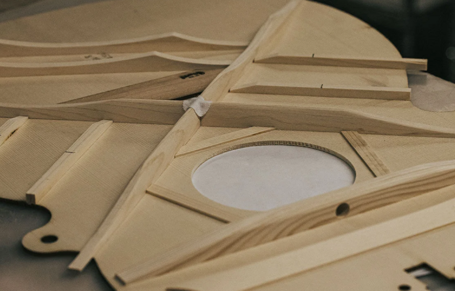 The Science of Acoustic Guitar Bracing Patterns: X-Bracing vs Scalloped vs Forward-Shifted