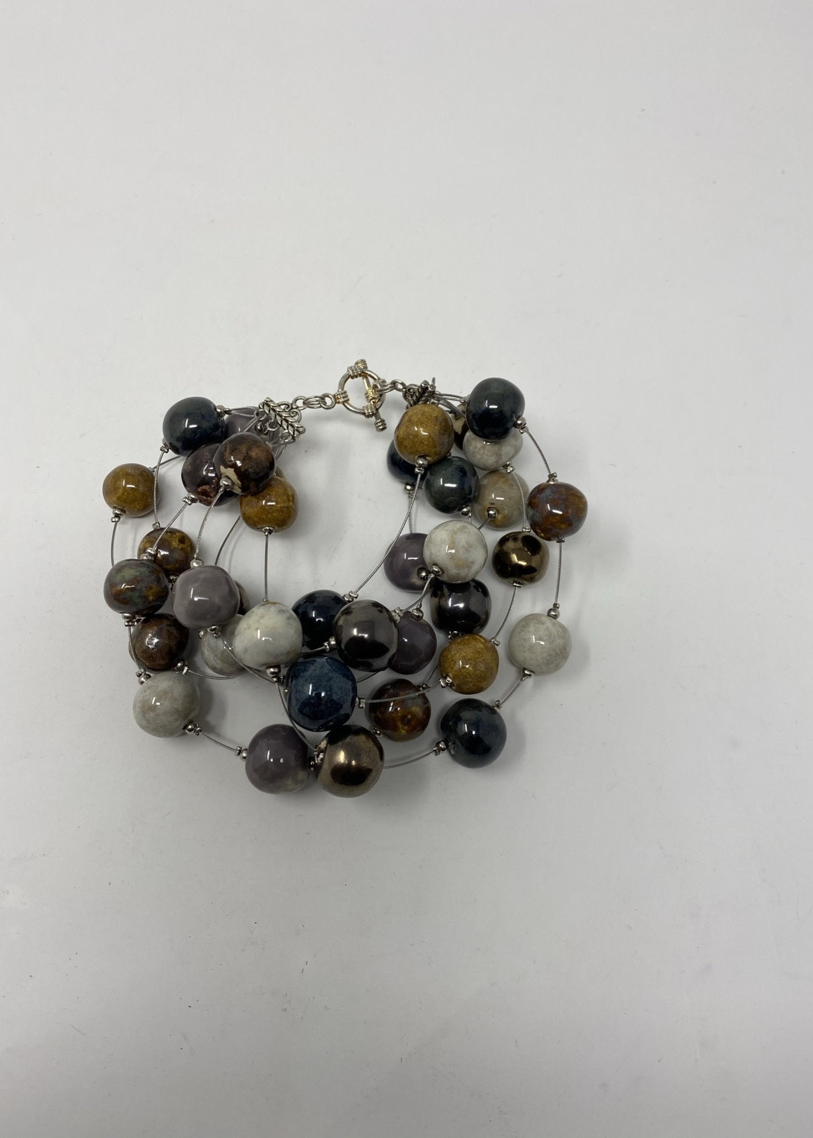 MULTI STRING ROUND BEADED BRACELET