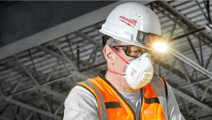 Worker wearing Milwaukee safety glasses