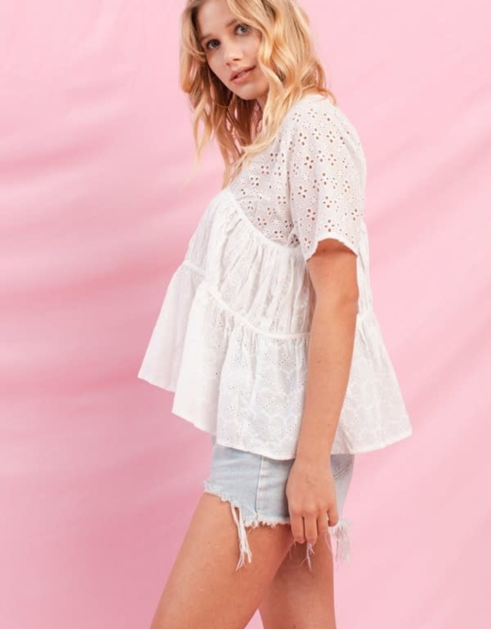 Oddi Tiered Eyelet Lace Blouse Cuffed Short Sleeves V-Neckline Button Key Hole Cut Out at the Back