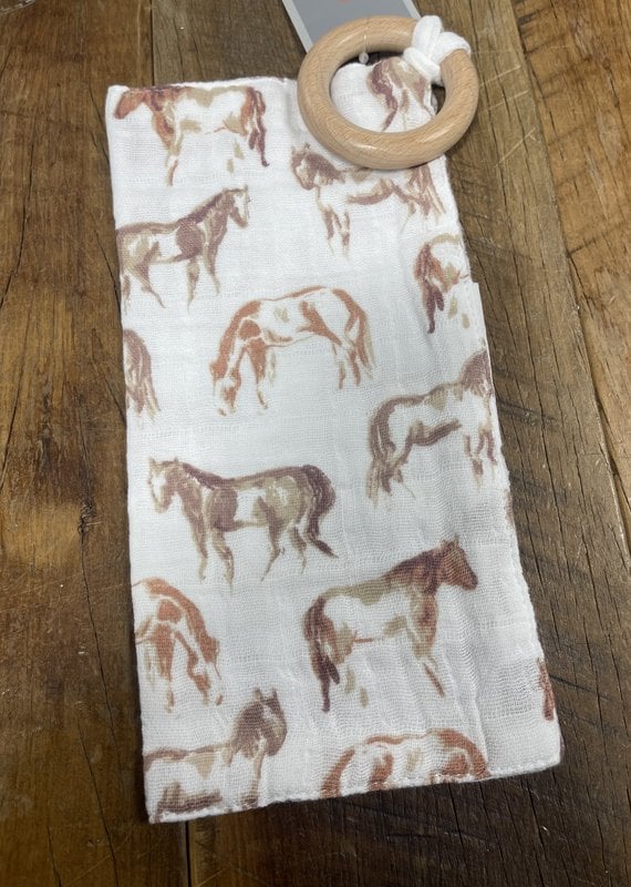 https://cdn.shoplightspeed.com/shops/642502/files/51941596/570x800x1/faire-newcastle-wild-horses-cotton-blankie-teether.jpg