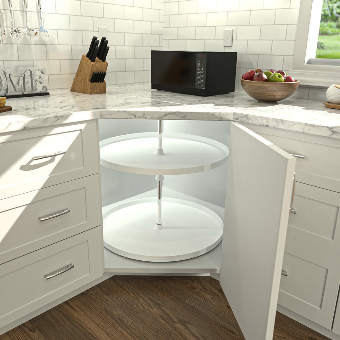 White kitchen cabinetry with round lazy susan hardware