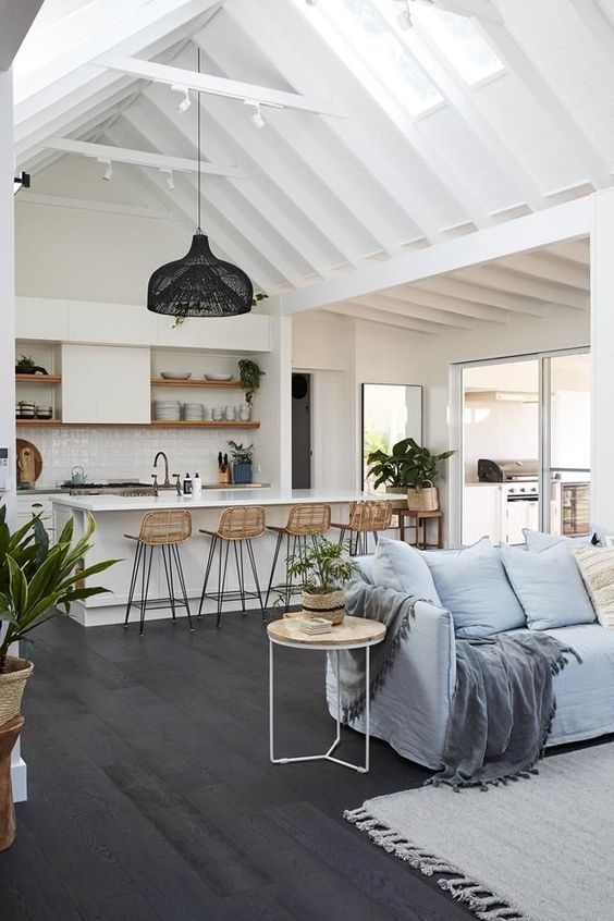 Coastal design kitchen with high vaulted wood ceilings