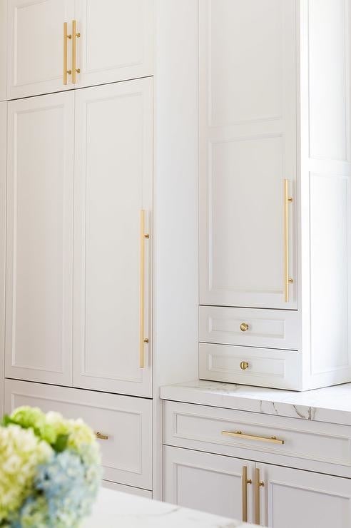 White kitchen with bright gold handles
