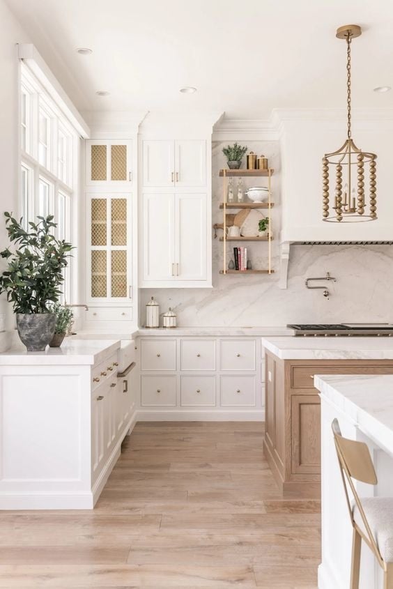 Bright white kitchen with gold hardware