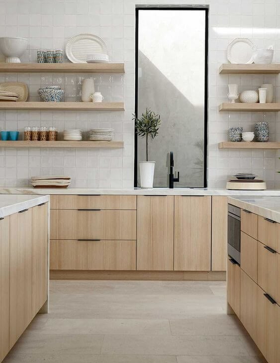 Modern kitchen with flat paneled cabinetry and sleek edge pulls