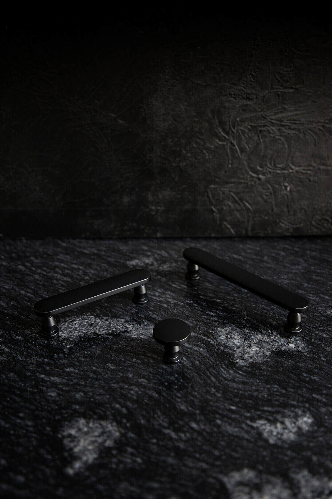 Black handles on marble black background