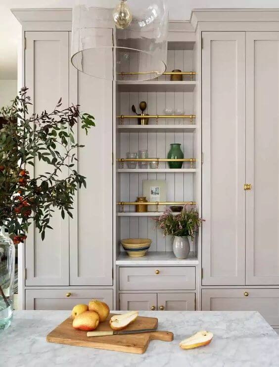 Open shelving with gold rails