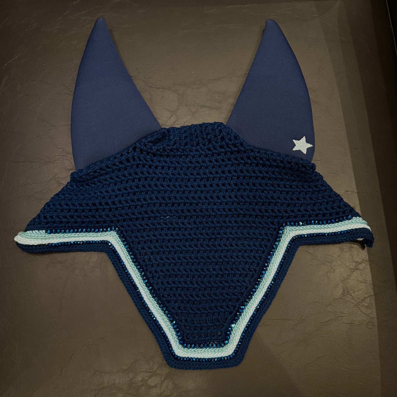 Equstar Custom Bonnet - Soundproof Ears, V - Shape, Tie Down, Drk Navy Base, R Lrg Royal Blue Crystal, 2R Sea Foam Thread, 2R Light Blue Thread, 1R Sm Royal Blue Crystals, Drk Blue Thread Trim, Teal Star