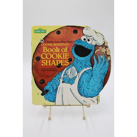Paperback Sesame Street: Cookie Monster's Book Of Cookie Shapes
