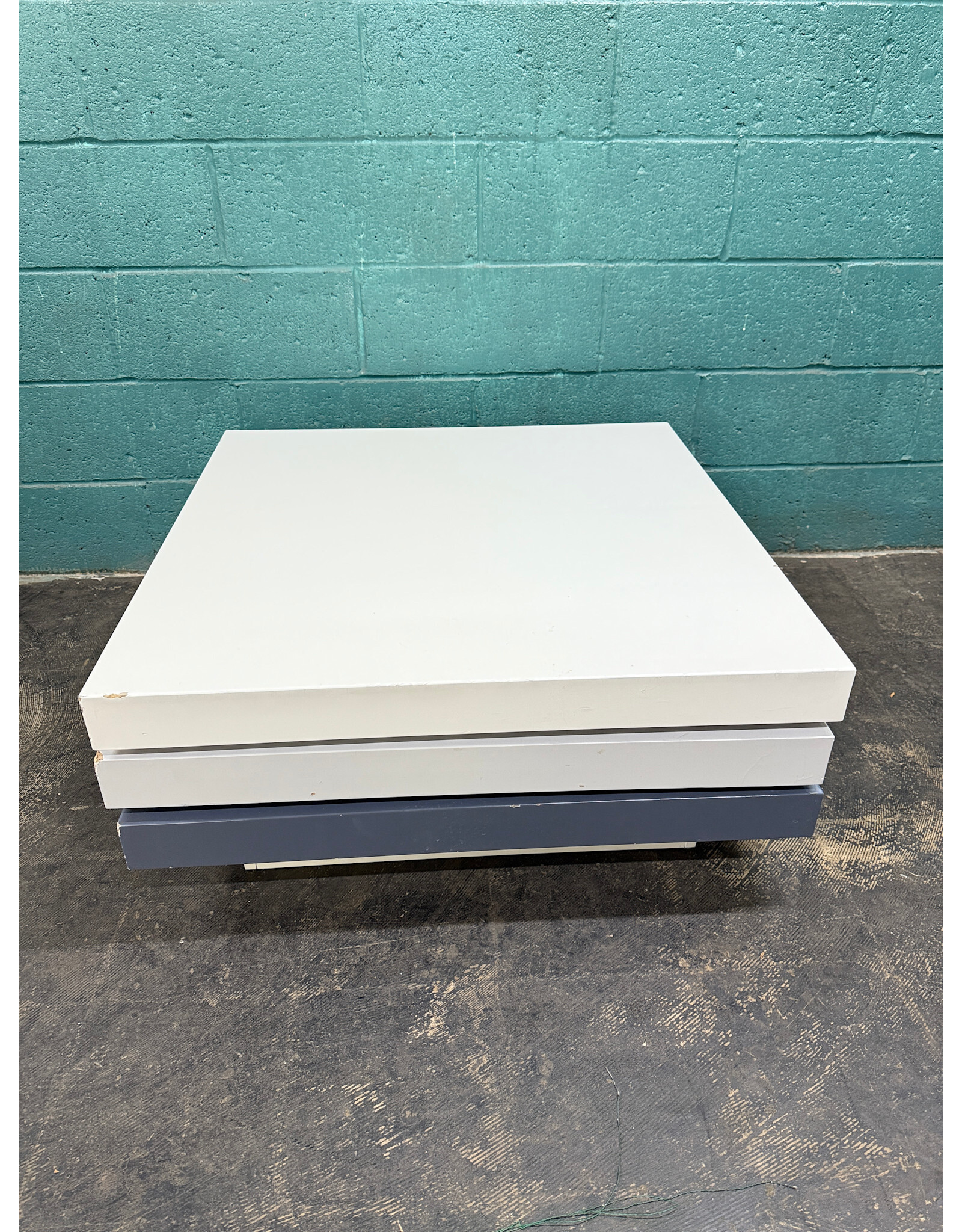 Modern Swivel Coffee Table With A Glossy White & Gray Finish