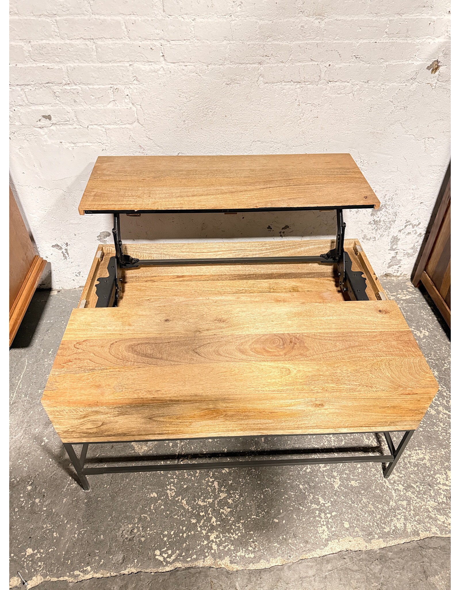 West Elm Industrial Storage Pop-up Coffee Table by West Elm in that Raw Mango