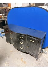 black, bow-front mahogany dresser or buffet with gold-toned hardware