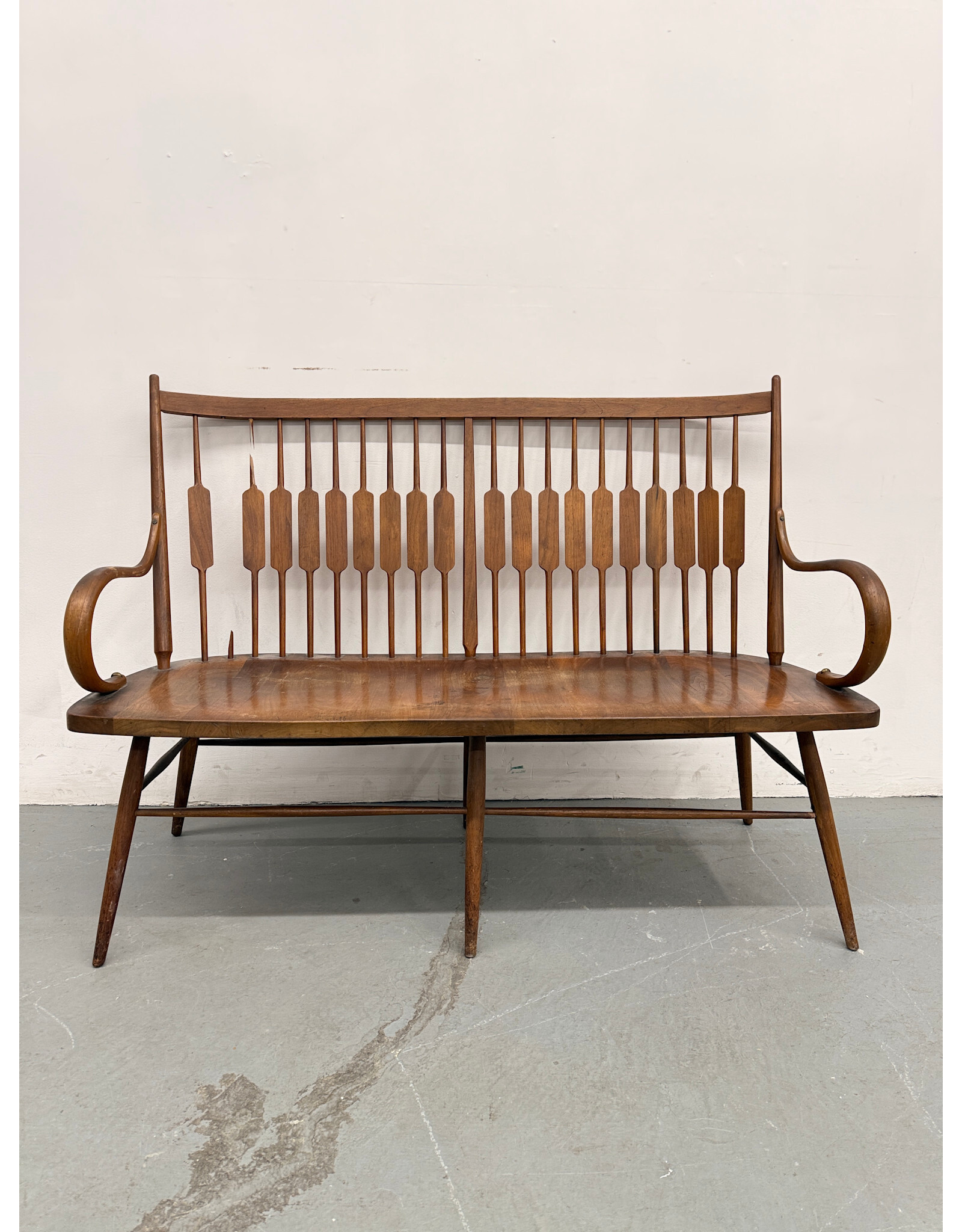 Mid-Century Modern "Declaration" walnut spindle back bench designed by Kipp Stewart and Stewart MacDougall
