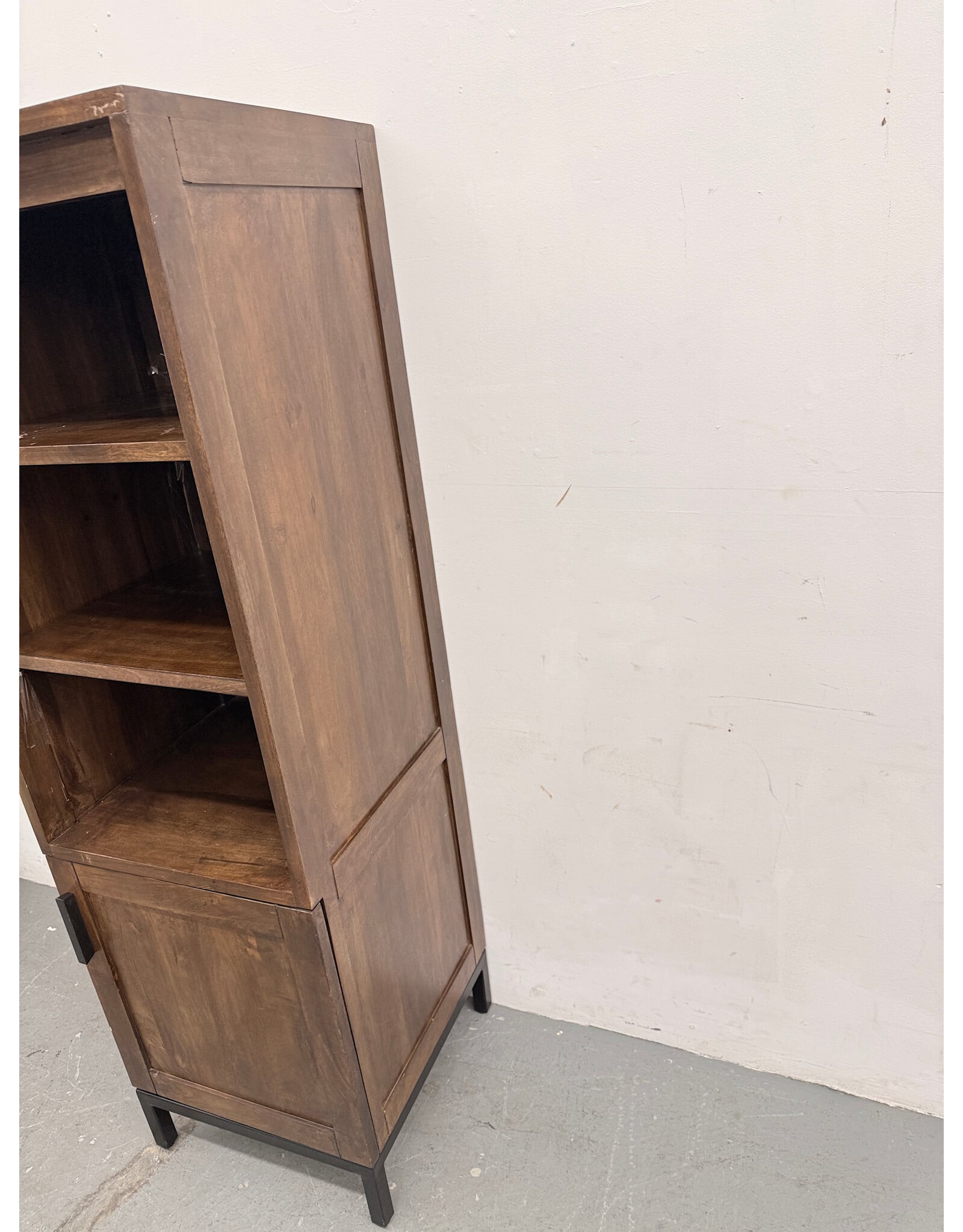 Crate & Barrel Wyatt Grey Media Storage Tower with three open shelves and a lower cabinet