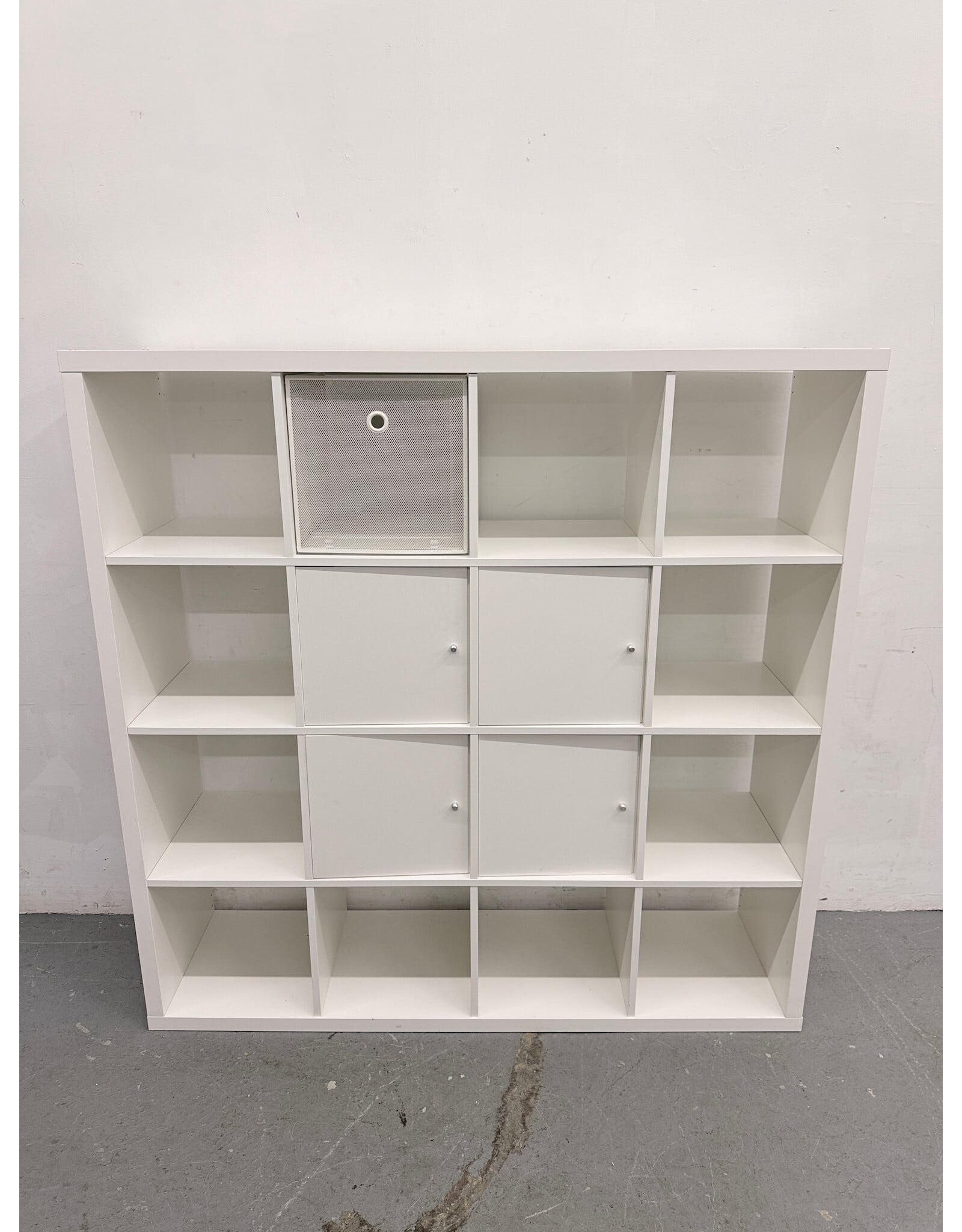 white IKEA KALLAX shelving unit with multiple storage