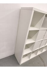 white IKEA KALLAX shelving unit with multiple storage