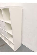 white IKEA KALLAX shelving unit with multiple storage