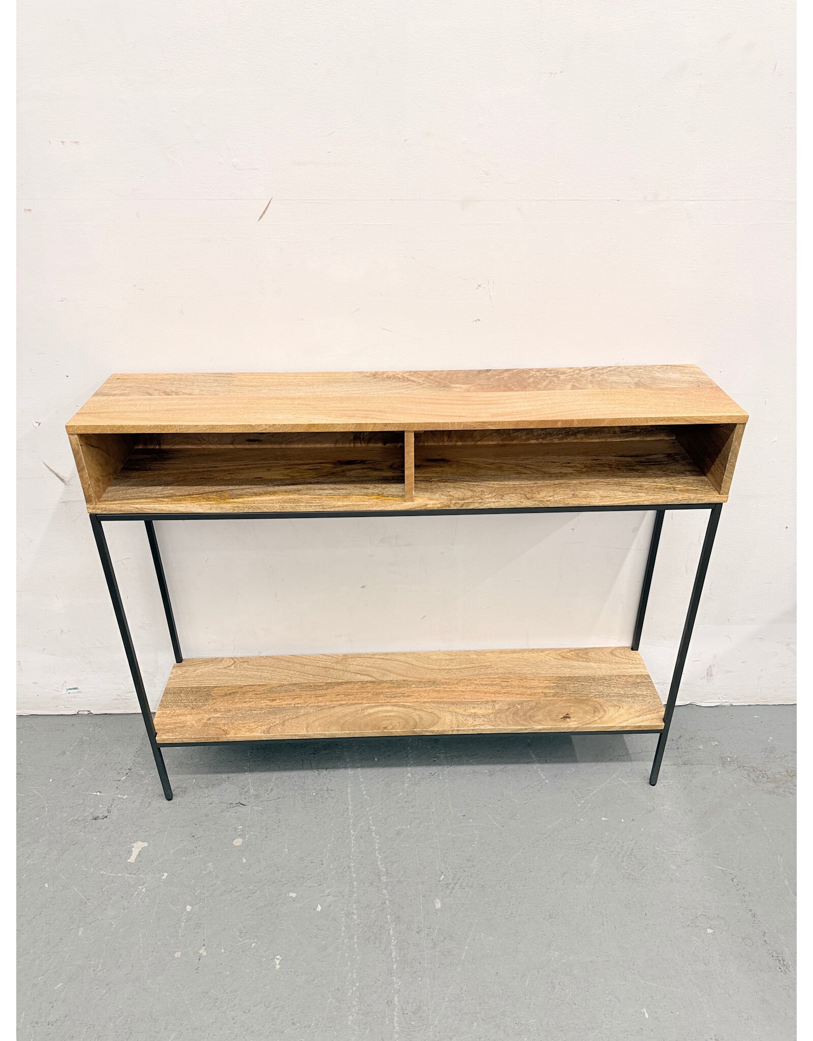 West Elm Industrial Storage Skinny Console in a natural mango wood finish with a black steel frame
