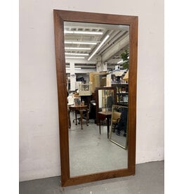 mid-century modern style rectangular mirror with a dark wood frame