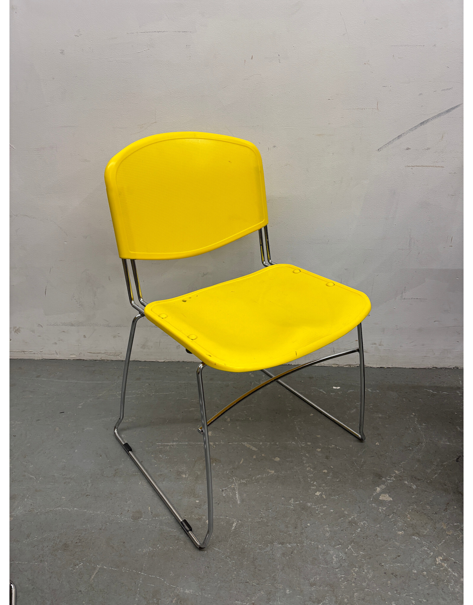 Plastic Yellow and Chrome Stacking Chair