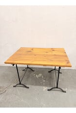 Rustic Wooden Plank-Top Table with Black Iron Trestle Base