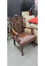 Late 19th-Century Renaissance Revival-Style Carved Wood Armchair with Ornate Lion-Head Crest and Figural Carvings