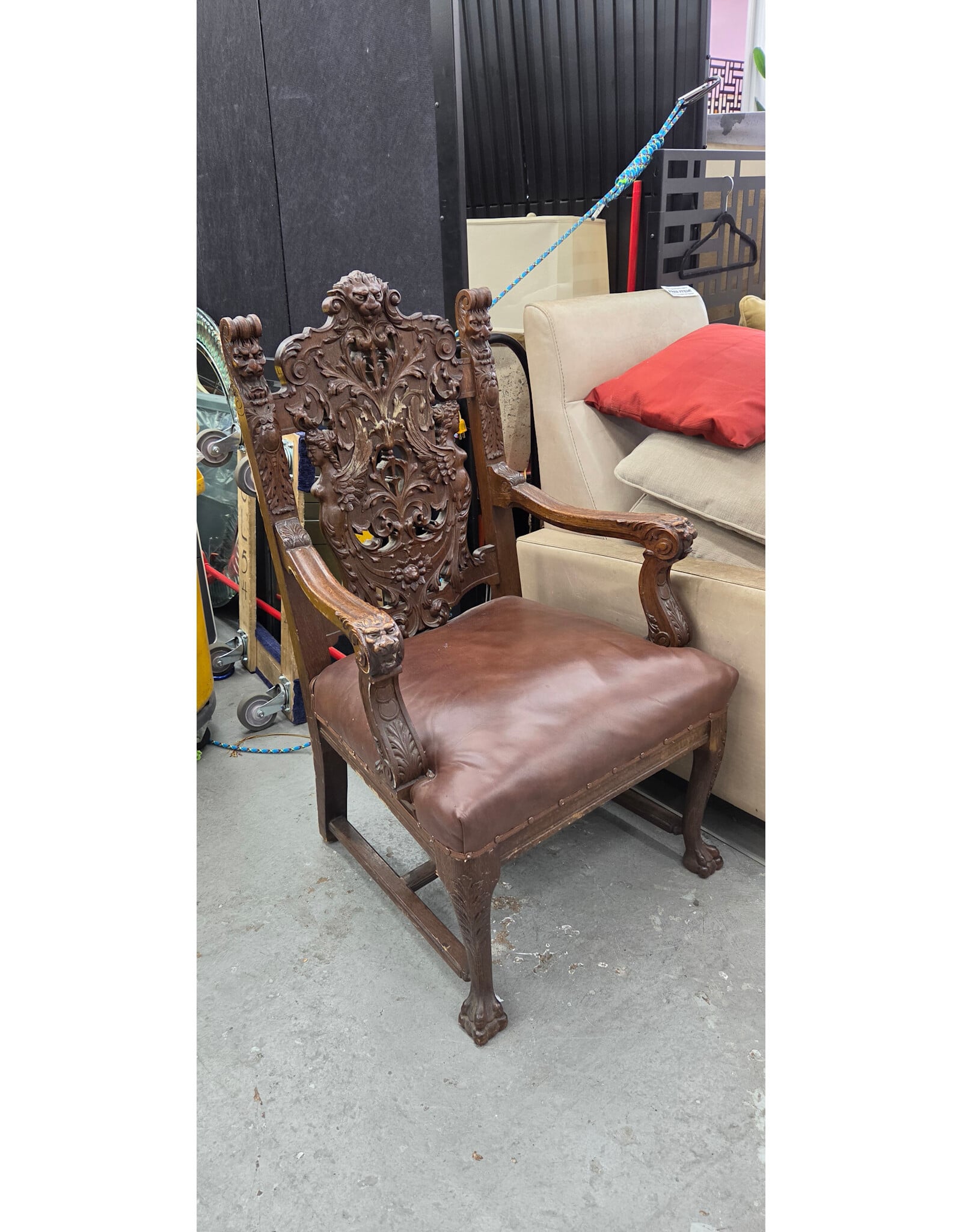 Late 19th-Century Renaissance Revival-Style Carved Wood Armchair with Ornate Lion-Head Crest and Figural Carvings