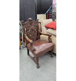 Late 19th-Century Renaissance Revival-Style Carved Wood Armchair with Ornate Lion-Head Crest and Figural Carvings