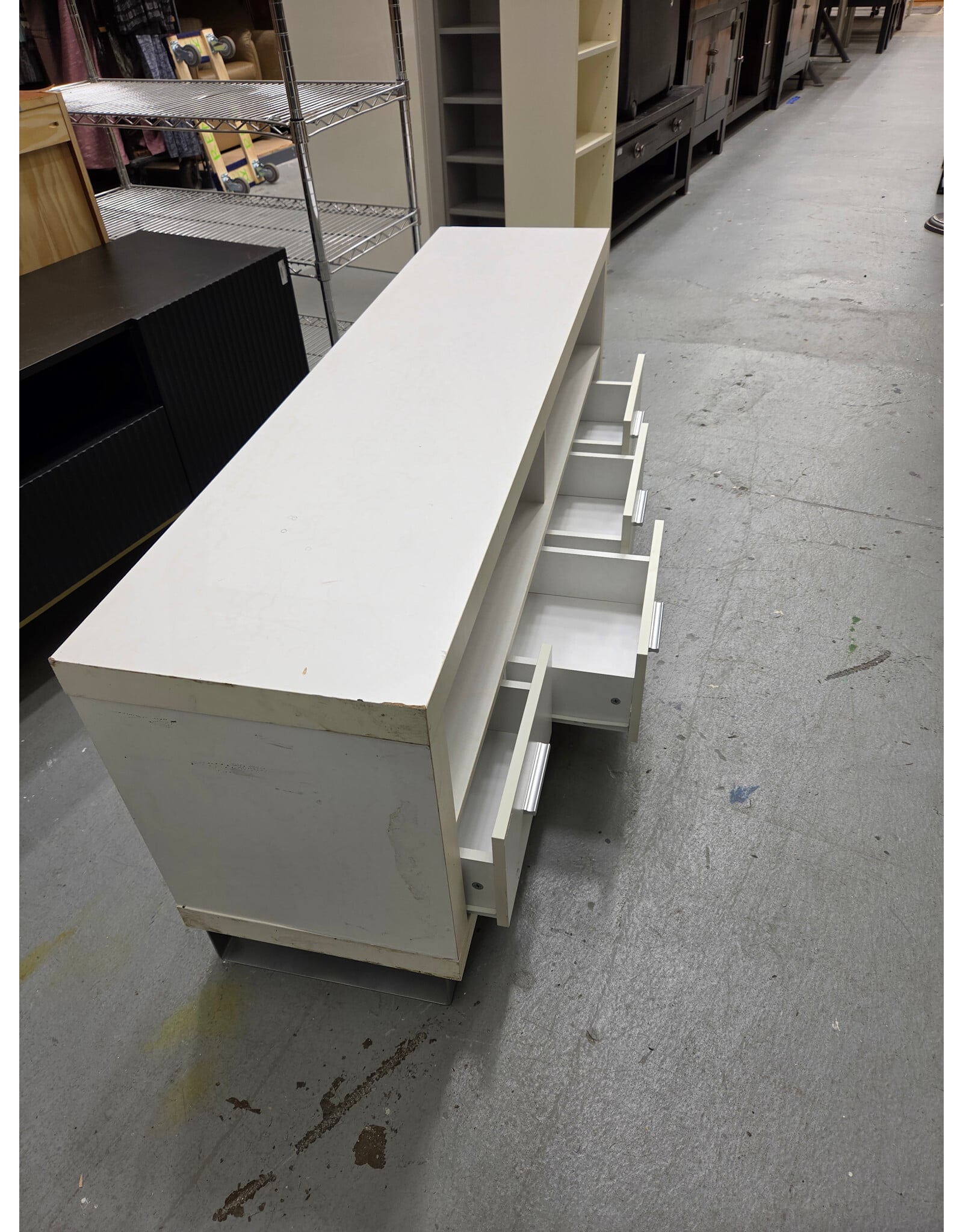 Modern White TV Stand with Four Lower Pull-Out Drawers and Open Upper Shelving Compartments