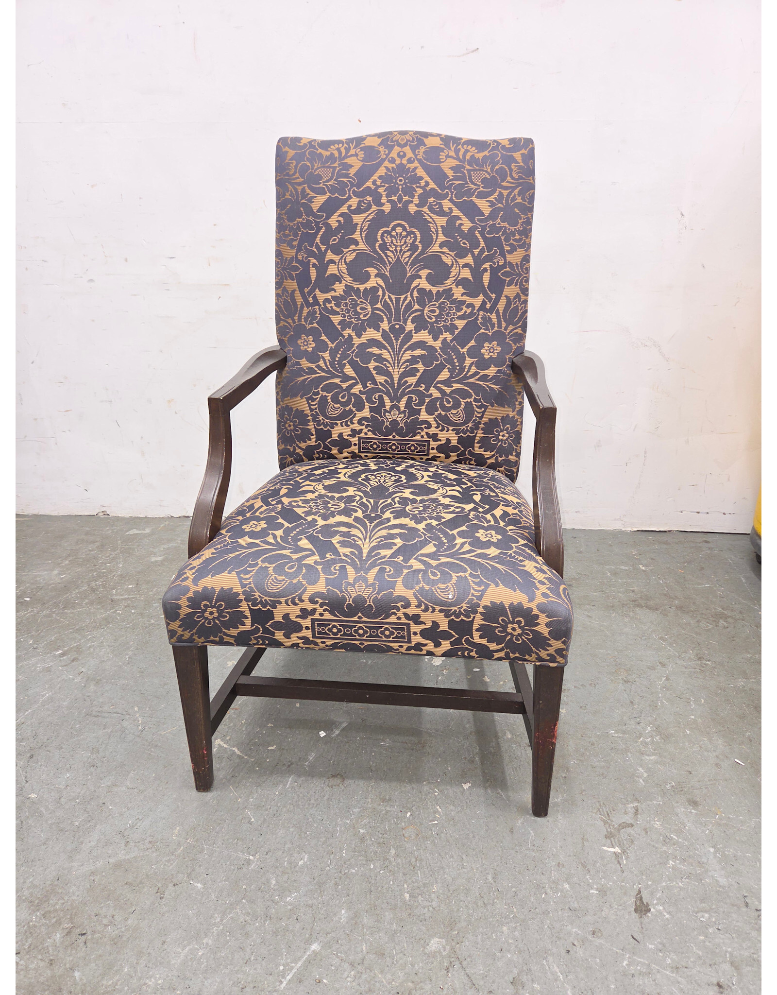High-Back Upholstered Armchair with Dark-Stained Wooden Arms and Legs