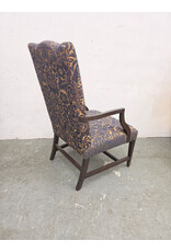 High-Back Upholstered Armchair with Dark-Stained Wooden Arms and Legs