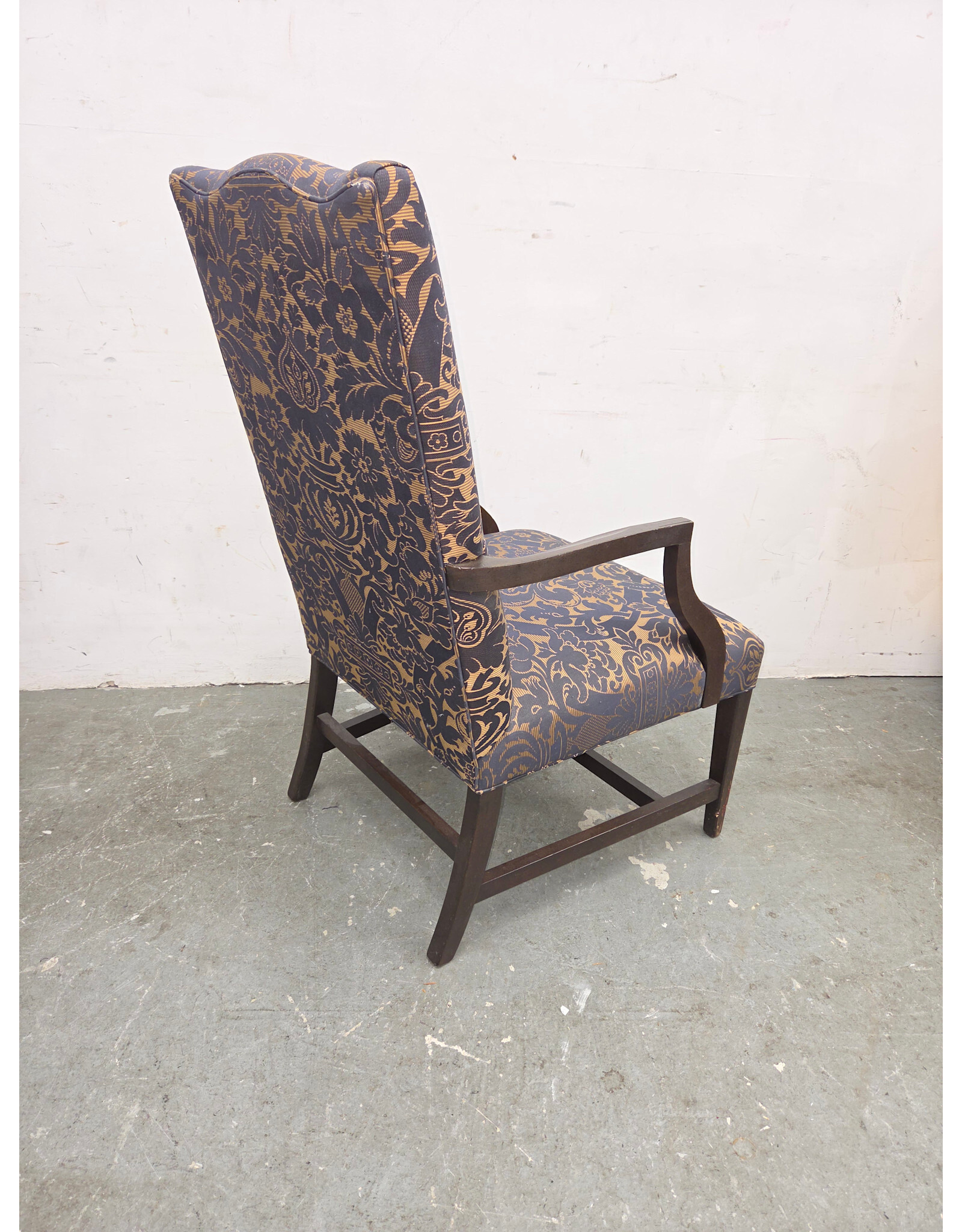 High-Back Upholstered Armchair with Dark-Stained Wooden Arms and Legs