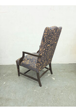High-Back Upholstered Armchair with Dark-Stained Wooden Arms and Legs