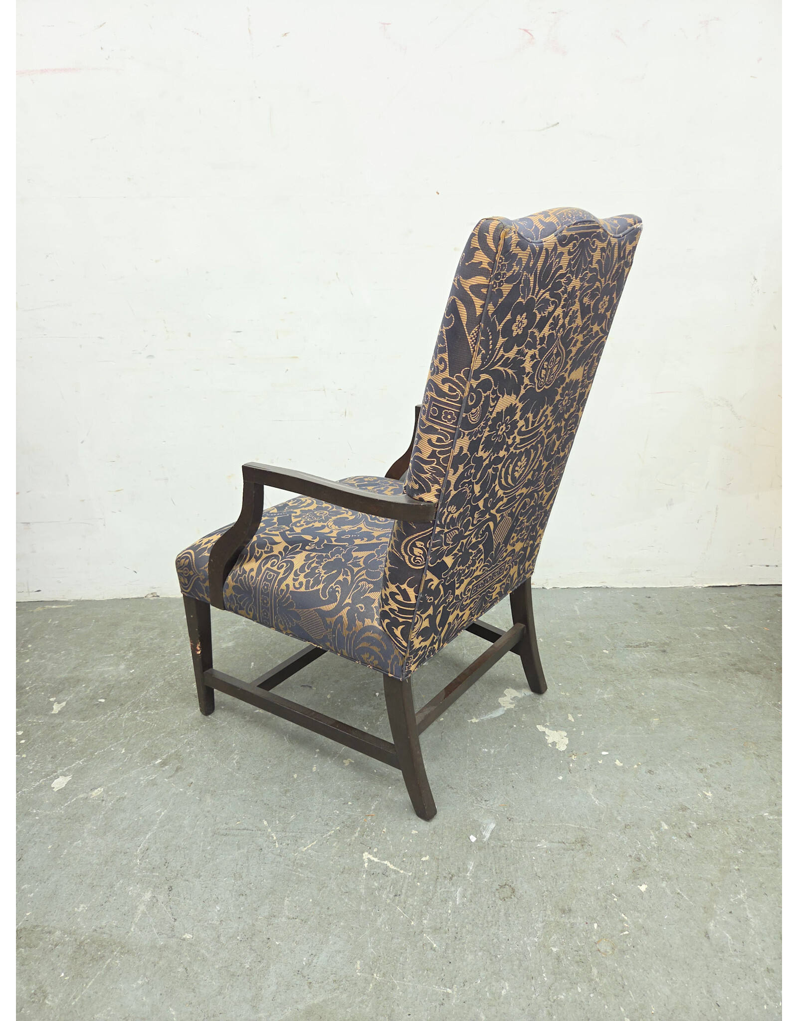 High-Back Upholstered Armchair with Dark-Stained Wooden Arms and Legs