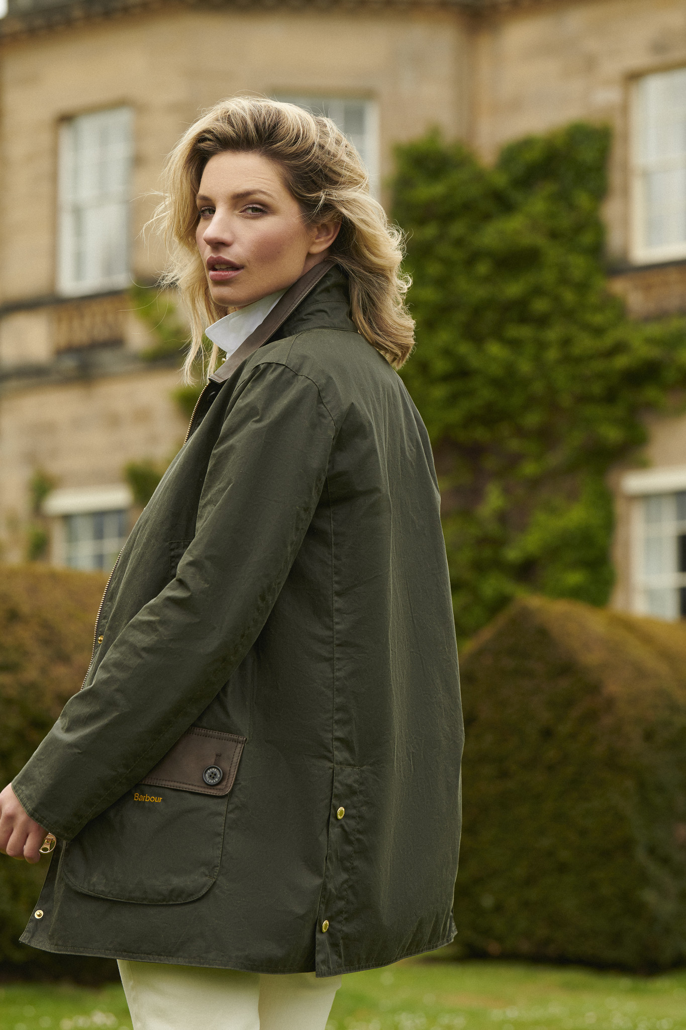 Woman in green Barbour wax jacket