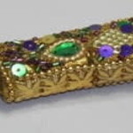 gold jeweled bottle opener