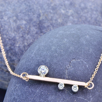 minimal 0.28cttw diamond 14k rose x axis bar pendant
